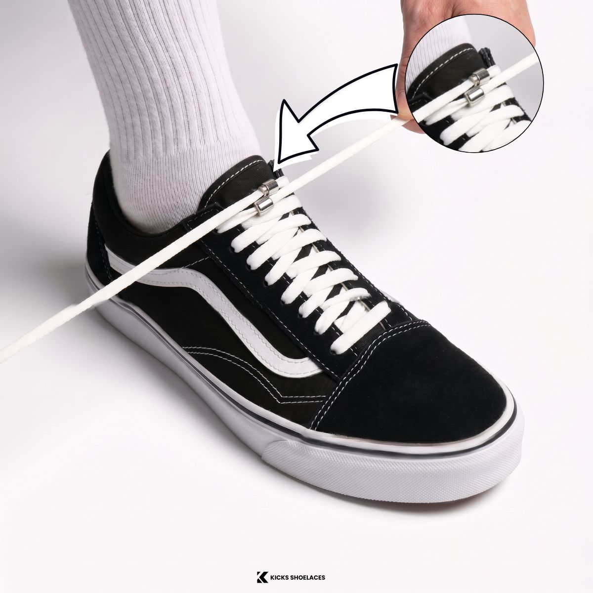 Person testing the fit of elastic no-tie shoelaces and adjusting silver capsule locks for an even and comfortable fit.