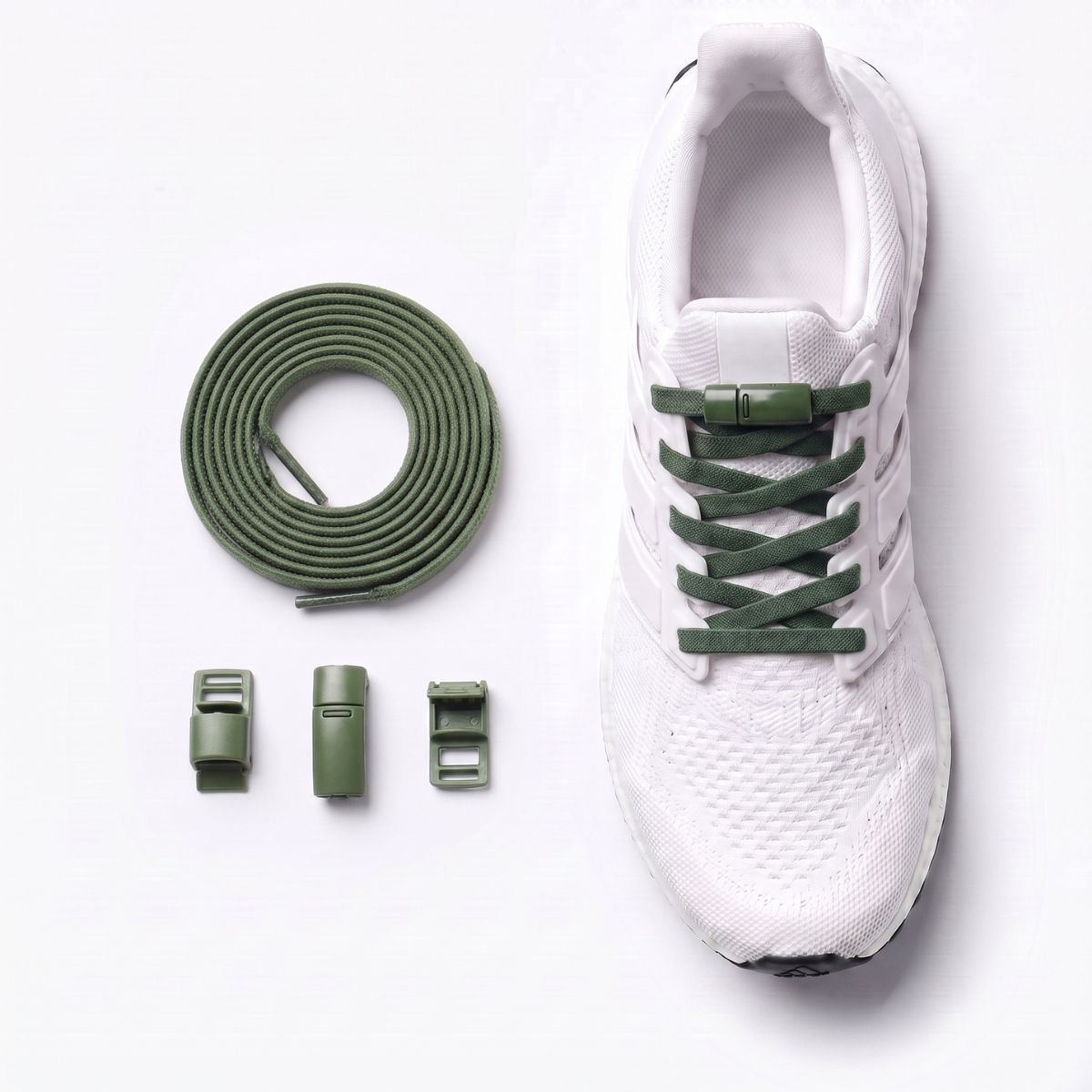 White sneaker fitted with magnetic no-tie shoelaces and a magnetic lock system.