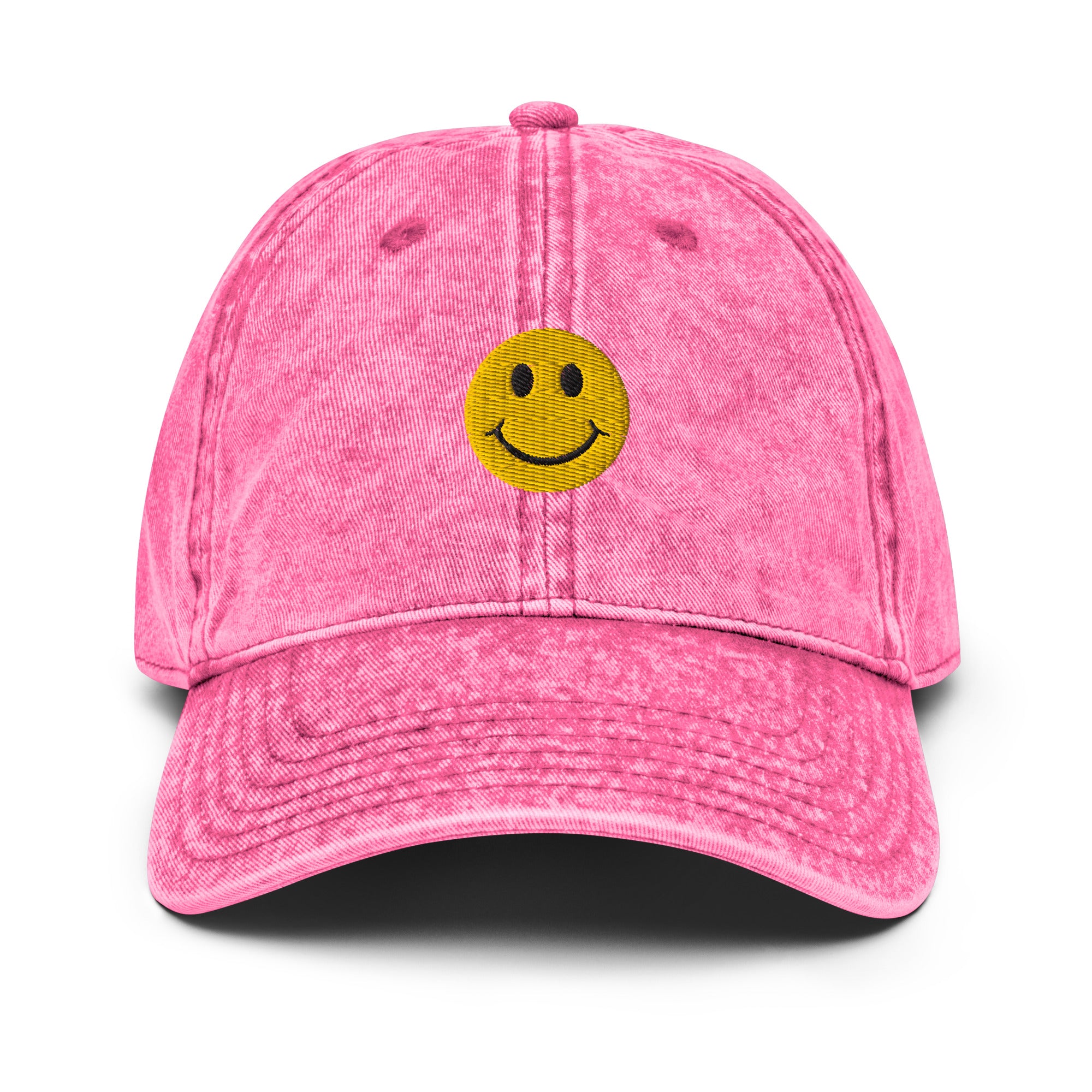 Pink smiley face embroidered baseball cap with adjustable fit, washed-out design for everyday wear and street style.