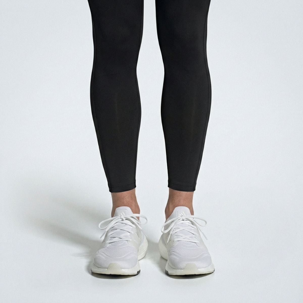 White replacement shoe laces on Adidas Ultraboost Light sneakers by Kicks Shoelaces.