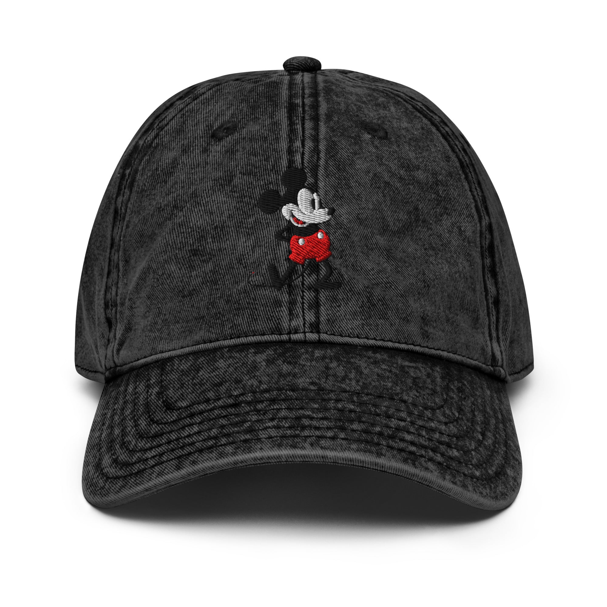 Black baseball cap with a 1928 Mickey Mouse steamboat willie cartoon character embroidered on it.