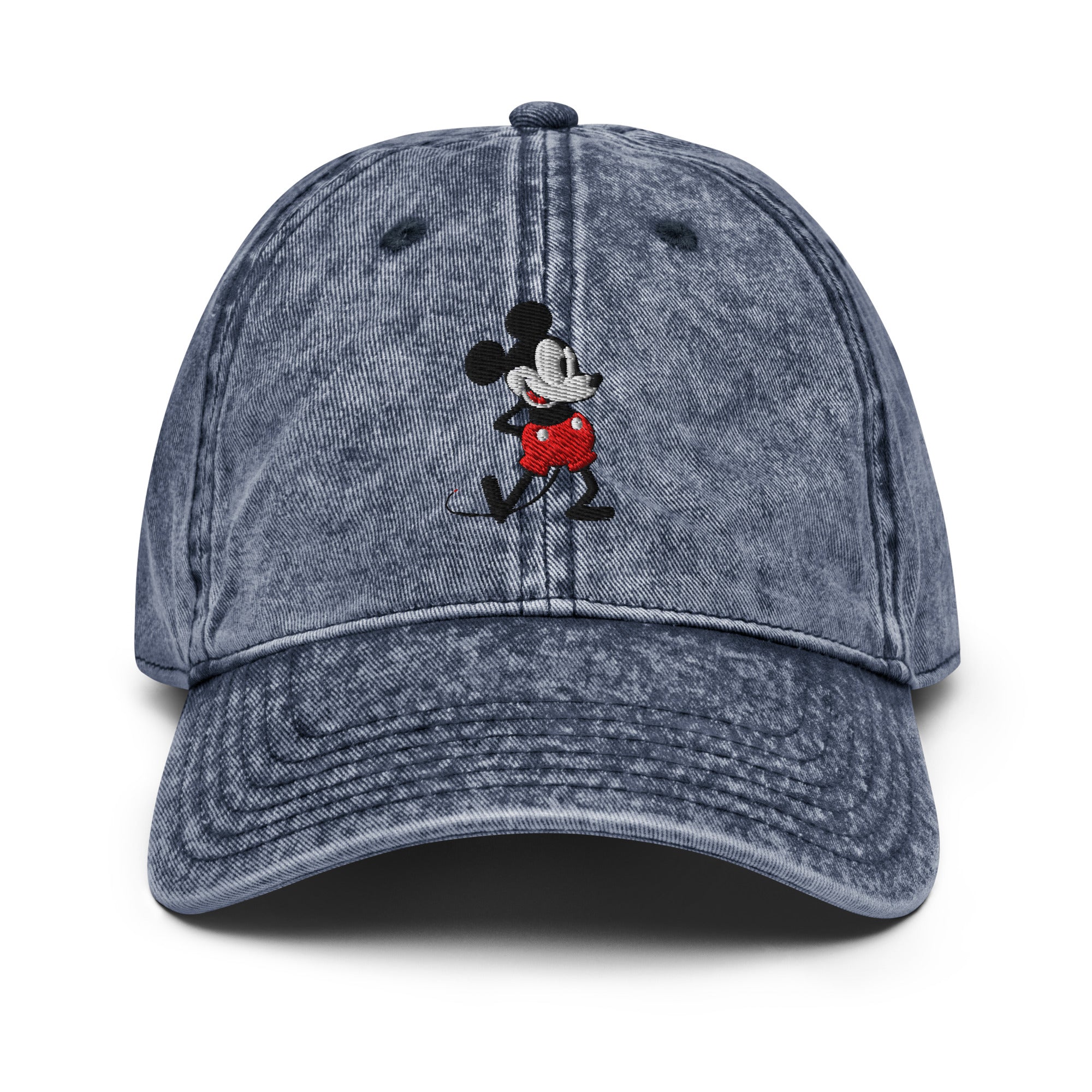 Navy baseball cap with a 1928 Mickey Mouse steamboat willie cartoon character embroidered on it.