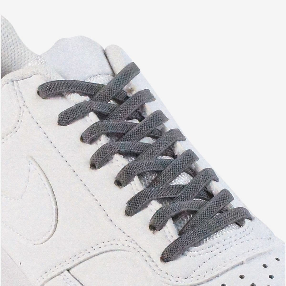 kids-no-tie-shoelaces-with-dark-grey-laces-on-nike-white-sneakers-by-kicks-shoelaces
